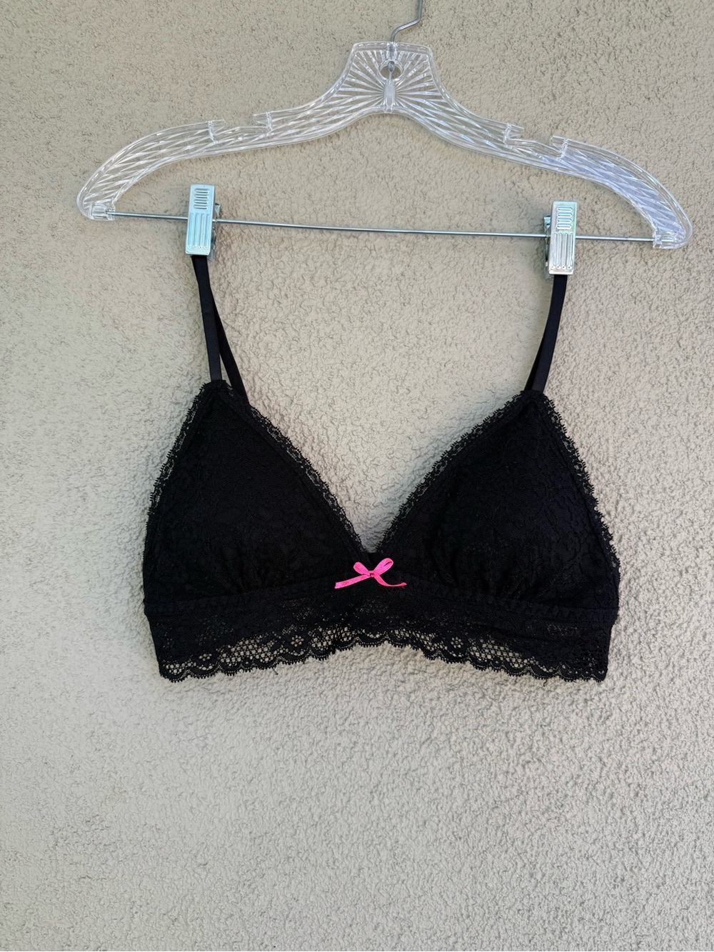 XOXO black lace, lightly padded, triangle bralette with adjustable straps.